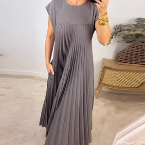 Gray pleated maxi dress with short sleeves, showcasing an elegant and versatile design.