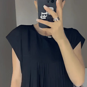 Gray pleated maxi dress with short sleeves, featuring an elegant and versatile design, worn by a model showcasing the dress's flowing silhouette and comfortable fit.