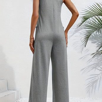Gray sleeveless wide-leg jumpsuit showcasing a casual summer style, featuring a flattering waistline and a comfortable one-piece design.