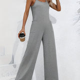 Gray sleeveless wide leg jumpsuit featuring a casual summer design with a fitted waist and a sleeveless top that extends to a wide leg style.