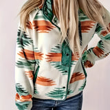 Green Aztec print women's zip-up bomber jacket modeled by a person wearing jeans, showcasing stylish winter outerwear in size 2XL with focus on the green pattern and zip-up design.