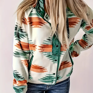 Green Aztec print women's zip-up bomber jacket modeled by a person wearing jeans, showcasing stylish winter outerwear in size 2XL with focus on the green pattern and zip-up design.