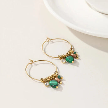 Green Crystal Gold Hoop Earrings by YA-CHAN Luxury Designer Jewelry featuring elegant green crystals set in gold hoops, perfect for enhancing any fashion ensemble.