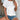 White short sleeve blouse with eyelet design, 2XL size, showcased on a mannequin.