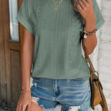 Green eyelet short sleeve blouse with laser cut design, breathable and trendy fashion item, displayed on a mannequin.