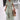 Green floral bohemian maxi dress featuring a V-neck and pockets, designed as resort wear. The dress is shown in a Verde1 color variant and 3XL size, highlighting the one-piece garment style with attention to the shoulder, sleeve, waist, and neck areas.
