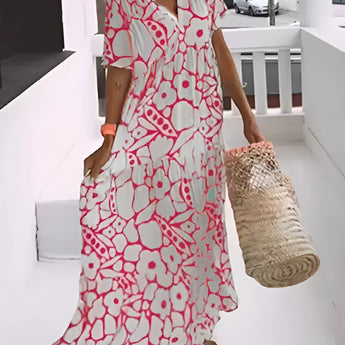 Green floral bohemian maxi dress with a V-neckline, featuring short sleeves and pockets, styled for resort wear in a Corallo Rosso1 pattern, size 3XL22.