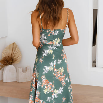 
A green floral wrap midi dress featuring a V-neck and sleeveless design, ideal for spring fashion.
