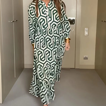 Green geometric long sleeve midi dress featuring a fitted waist, a stylish collar, and a fashionable design ideal for fall events.