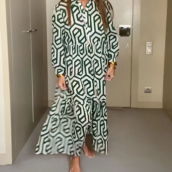 Green geometric pattern long sleeve midi dress for women, featuring a fitted waist and knee-length design, suitable for fall fashion.
