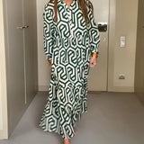 Green geometric long sleeve midi dress for women's fall fashion, featuring a structured collar and fitted waist design suitable for daytime events.