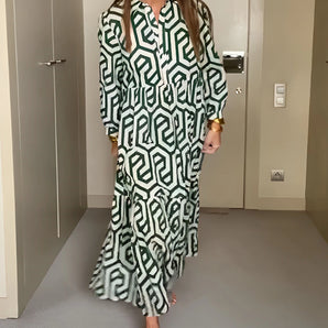 Green geometric long sleeve midi dress for women's fall fashion, featuring a structured collar and fitted waist design suitable for daytime events.