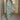 
A green geometric long sleeve midi dress for women, showcasing fall fashion with a knee-length design.