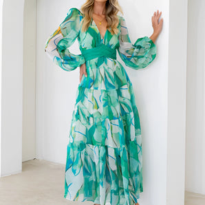 Green leaf print chiffon maxi dress with a V-neck and long sleeves, showcasing a flowy and elegant design suitable for summer wear.