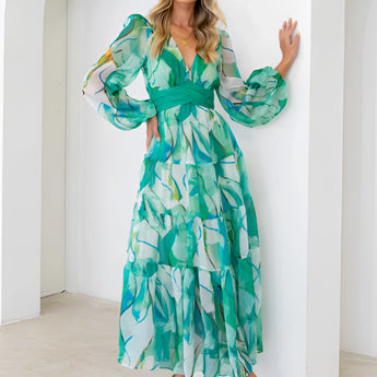 Green leaf print chiffon maxi dress with a V-neck and long sleeves, showcasing a flowy and elegant design suitable for summer wear.