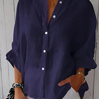 A dark blue, 5XL women's relaxed fit button-down blouse made from linen, featuring long sleeves, a collar, and a comfortable waistline.