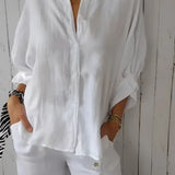 A white women's relaxed fit button-down blouse made from linen, featuring long sleeves, a classic collar, and a comfortable, loose design suitable for casual or professional wear in a 5XL size.