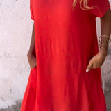 A red, oversized linen tunic dress designed for casual summer wear, featuring a breathable fabric, short sleeves, and a stylish yet comfortable fit.