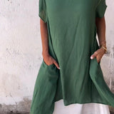 Oversized casual green linen tunic dress for summer in 3XL (US 20) featuring a breathable and stylish design with short sleeves and a relaxed fit.