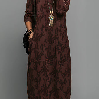 Green patterned long sleeve midi dress featuring a tribal necklace, displayed in a burgundy color, size 3XL. The dress has a fitted waist and a stylish collar.