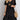 
A woman wearing a green pleated midi dress with short sleeves, suitable for summer casual wear. The dress is styled in a Nero color option and is available in size 3XL.