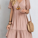 A pink short sleeve summer casual dress in size 3XL, featuring pleats and a midi length, shown with emphasis on the shoulder, waist, and neckline design.