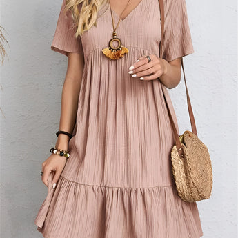 A pink short sleeve summer casual dress in size 3XL, featuring pleats and a midi length, shown with emphasis on the shoulder, waist, and neckline design.