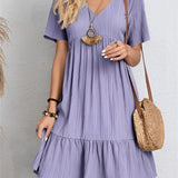 
A short-sleeve pleated midi dress in a vibrant viola color, designed for summer casual wear, displayed in a size 3XL. The dress features a flowing one-piece garment style with a defined neck and shoulder line.