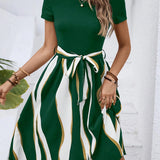 A casual summer green striped belted flare dress with short sleeves, shown in size 2XL.