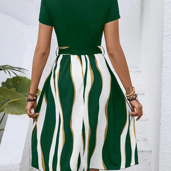 A casual summer dress with green stripes, short sleeves, a belted waist, and a flared skirt.