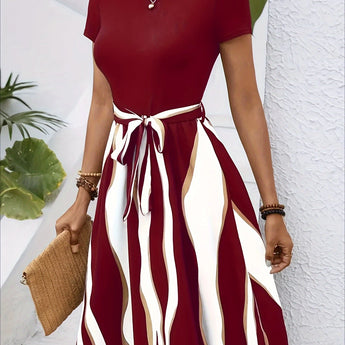 A casual summer short sleeve green striped belted flare dress, shown in red, size 2XL.
