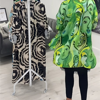 Green tropical print women's designer statement jacket featuring chic lightweight material, showcasing vibrant patterns and a stylish design with a focus on fashion detailing like structured shoulders, defined neckline, and tailored sleeves.