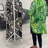 Green tropical print women's designer statement jacket featuring a chic, lightweight design with long sleeves and a stylish collar.