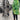 Green tropical print women's designer statement jacket featuring a chic, lightweight design with long sleeves and a stylish collar.