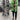 Green tropical print women's designer statement jacket, lightweight with chic fashion appeal, featuring a vibrant pattern and tailored for a stylish fit.