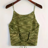 Green velvet crop top with adjustable straps, suitable for party wear; features a sleeveless design with a fitted waist.