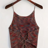 Green velvet crop top with adjustable straps, designed for party wear, displayed on a clothes hanger with a stylish fashion pattern.