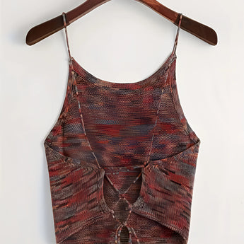 Green velvet crop top with adjustable straps, designed for party wear, displayed on a clothes hanger with a stylish fashion pattern.
