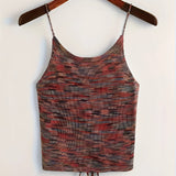 A red velvet crop top with adjustable straps, designed for party wear, displayed on a clothes hanger. The sleeveless top features a flattering neckline and a fitted waist, suitable for size 2XL.