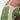 Women's green and white racerback yoga tank top designed for moisture-wicking, displayed on a model showcasing sportswear options for the gym with focus on shoulder, waist, and thigh areas.