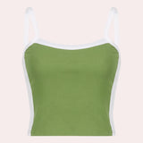 Women's green and white racerback yoga tank, designed for moisture-wicking performance, shown on a mannequin with a focus on activewear styling and comfortable fit.