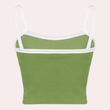 
A women's green and white racerback yoga tank designed for moisture-wicking and gym wear.