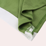 Green and white racerback yoga tank for women, featuring a moisture-wicking fabric with a stylish pattern, designed for gym wear.