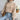 Green women's chunky cable knit high-neck wool sweater in apricot, featuring long sleeves and a textured design suitable for cold weather.