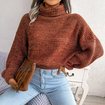 Green chunky cable knit high-neck wool sweater for women, showcasing detailed knit patterns on the body and sleeves, with a high neckline and a cozy, textured design.