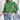 Green women's chunky cable knit high-neck wool sweater in a large size, featuring long sleeves and intricate knitting details.