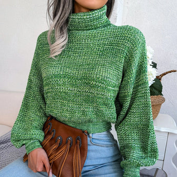 Green women's chunky cable knit high-neck wool sweater with long sleeves and textured design.