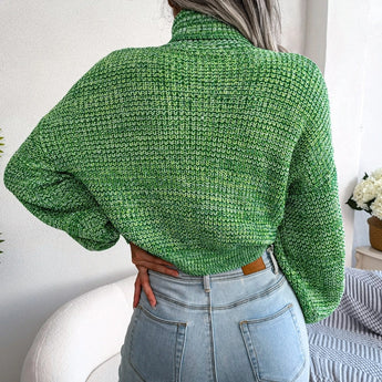 
A green women's chunky cable knit high-neck wool sweater, featuring long sleeves and a cozy texture.