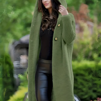 Green women's oversized hooded cardigan with a chunky knit design, featuring long sleeves and a cozy, relaxed fit.