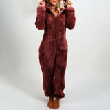 A woman wearing a burgundy 5XL fleece hooded onesie, showcasing the cozy winter jumpsuit with sleeves, a collar, and a waist design.